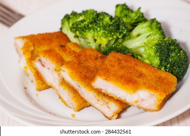 Fried Breaded Fish Fillets With Broccoli