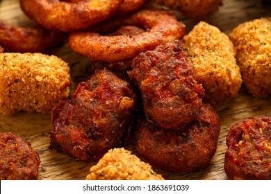 Fried Buffalo Onion Rings, Tater Tots And Sweetcorn Fritters With Ketchup And Beer. Party Take Away Food