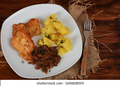 Fried Cabbage With Dried Mushrooms, Boiled Potatoes With Dill And Breaded Pork Tenderloin