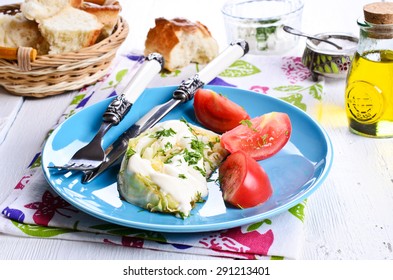 Fried Cabbage With White Sauce In A Ceramic Dish