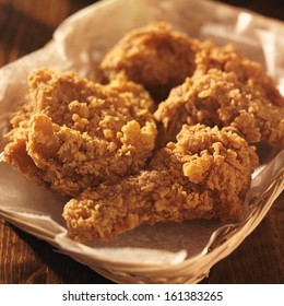 Fried Chicken Basket In Golden Light