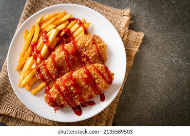 fried chicken breast fillet steak with French fries and ketchup