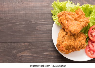 Fried Chicken Breast On A Wooden Background.