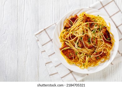 Fried  Chicken Breast Scampi With Gluten Free Pasta On White Plate On White Wooden Table, Horizontal View From Above, Flat Lay, Free Space