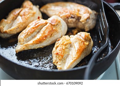 Fried Chicken Breasts On Vegetable Oil, Iron Cast 