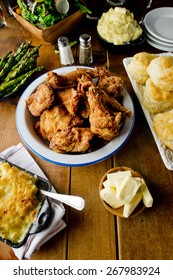 Fried Chicken. Chicken Dinner Served With Potatoes, Vegetables And Rolls. Chicken, Soaked In Buttermilk, Dredged In Flour, Spices And Fried In A Cast Iron Skillet. Classic American Southern Cuisine. 