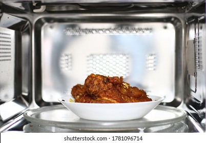 Fried Chicken Dish Inside Of Microwave Oven