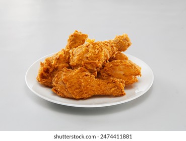 Fried Chicken fast food is a food made from pieces of chicken meat coated in flour - Powered by Shutterstock