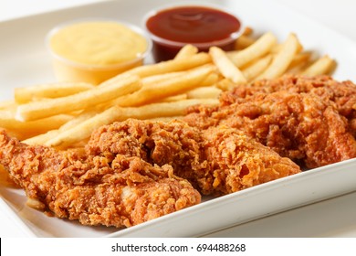 Fried Chicken Fingers With French Fries And Dipping Sauce