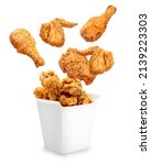 Fried chicken flying out of paper bucket isolated on white background, Fried chicken on white With clipping path.
