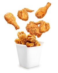 Fried Chicken Flying Out Of Paper Bucket Isolated On White Background, Fried Chicken On White With Clipping Path.