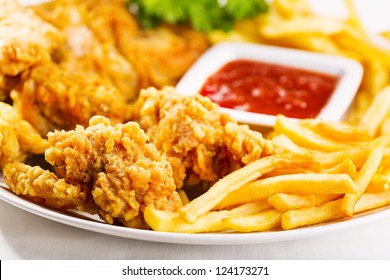 Fried Chicken With Fries On A Plate