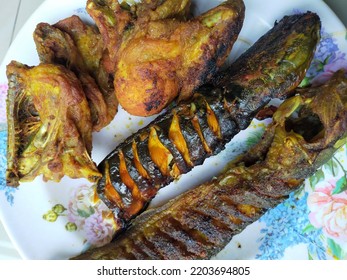 Fried Chicken And Grilled Catfish On A Plate