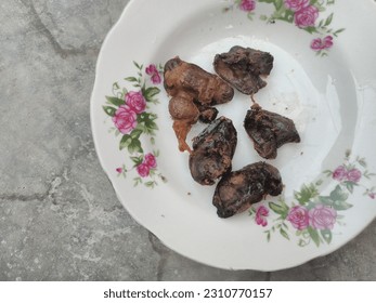 Fried chicken hearts on a white glass plate - Shutterstock ID 2310770157