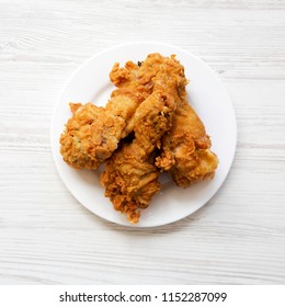 Fried Chicken Legs On A White Round Plate, Top View. From Above, Overhead, Flat Lay.