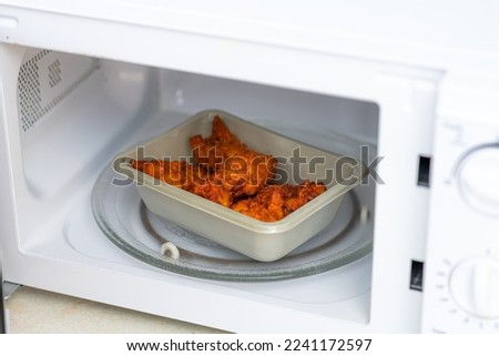 Fried Chicken Microwave Ready Meal being cooked