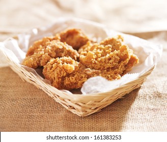 Fried Chicken Pieces In A Basket