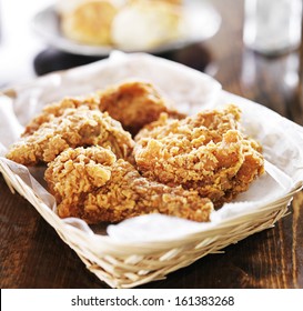 Fried Chicken Pile In A Basket On Table