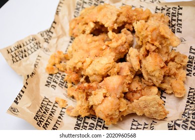 Fried Chicken Popcorn KFC Style.crispi And Testy Hot Crispy Snack With Oill Paper On White And Black Background.