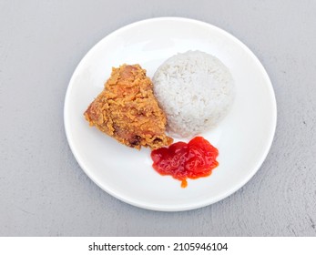 Fried Chicken with Rice on White Plate - Shutterstock ID 2105946104