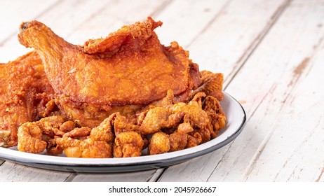 Fried Chicken And Fried Chicken Skin In Ceramic Plate On White Old Wood Texture Background With Copy Space For Text