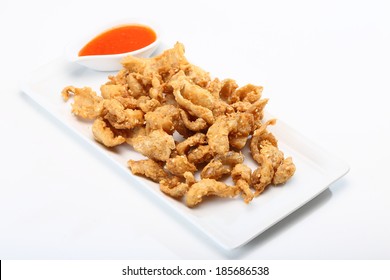 Fried Chicken Skin Served On White Dish 