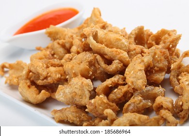 Fried Chicken Skin Served On White Dish 