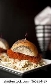 Fried Chicken Slider With Homemade Coleslaw On A Poppy Seed Roll. Served With French Fries.