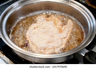 Fried Chicken Strips In Frying Pan