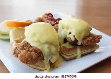 Fried Chicken And Waffles With An Eggs Benedict And Hollandaise Sauce On Top For Brunch