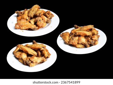 Fried chicken wing isolated with clipping path, no shadow in black background, fast food