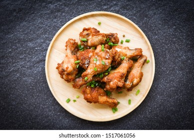 Fried Chicken Wings On Wooden Plate With Salt And Spring Onion , Top View / Baked Chicken Wings BBQ , Wings Crispy