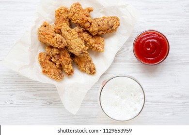 Fried Chicken Wings With Red Pepper Sauce, Cold Beer, Top View. Flat Lay, Overhead.