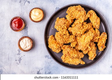 Fried Chicken Wings With Various Sauces, Top View.