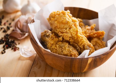 Fried Chicken In Wooden Bowl With Garlic And Pepper Ingredient