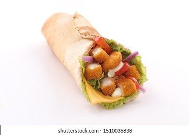 fried chicken wrap in pita bread with fresh vegetables and sauce on white background isolated