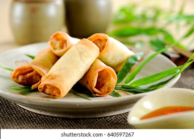 Fried chinese spring rolls with sweet chili sauce. - Shutterstock ID 640597267
