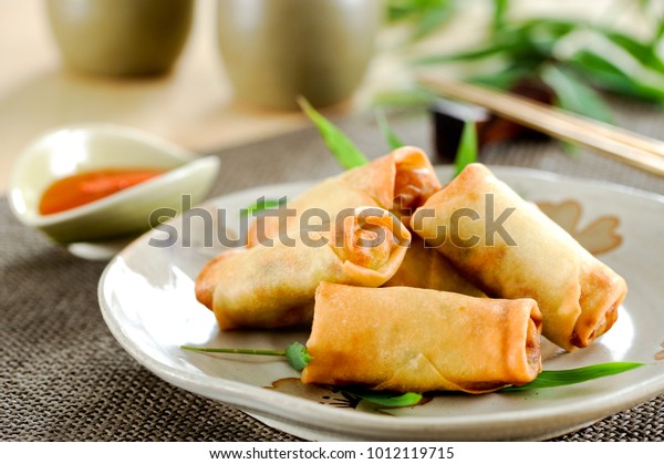 Fried\
chinese spring rolls with sweet chili\
sauce.