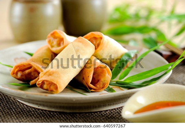 Fried\
chinese spring rolls with sweet chili\
sauce.