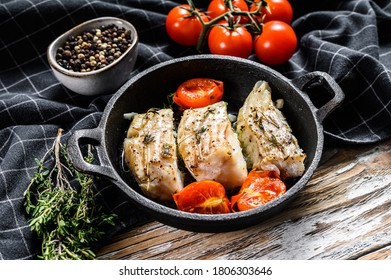 Fried Cod Fish Fillet With Spice In A Cast Iron Pan. White Background. Top View.