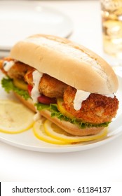 Fried Crab Cake Sandwich With Lettuce Tomato And Tartar Sauce