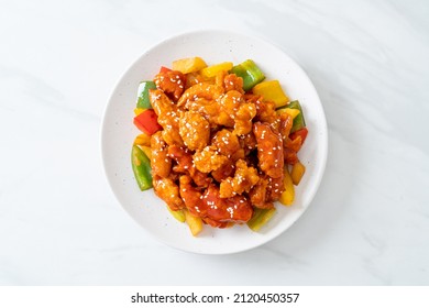 fried crispy chicken with sweet and sour sauce in Korean style - Shutterstock ID 2120450357