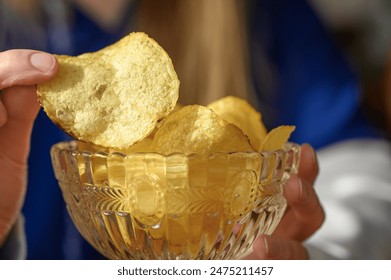 Fried crispy salted homemade potato chips - Powered by Shutterstock