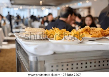 Fried dumplings and buns on top of a rolling cart at a dim sum restaurant in Burwood Chinatown — Sydney, Australia