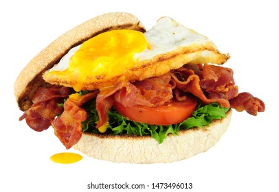 Fried Egg And Bacon Filled English Muffin Bread Roll Isolated On A White Background