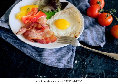 Fried Egg, Bacon And Pepper And Salad As Healthy Breakfast. Keto Diet