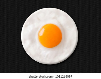 Fried egg in circular shape.