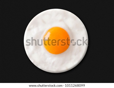 Fried egg in circular shape.