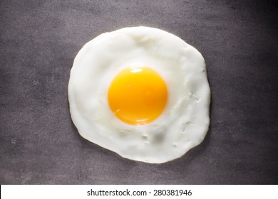 Fried Egg And Gray Background. Studio Photograpy.