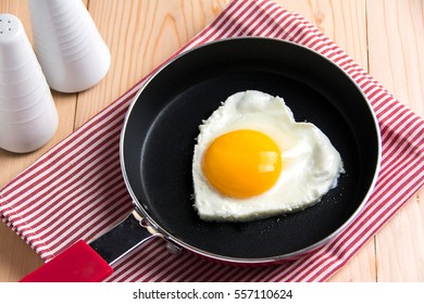 Fried Egg In Heart Shape In A Pan